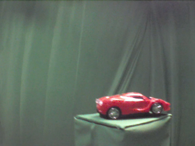 45 Degrees _ Picture 9 _ Red Toy Sportscar.png